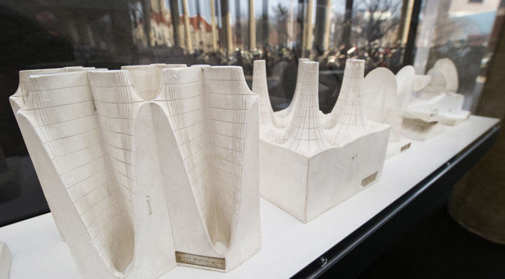 A series of abstract models carved from a solid white material