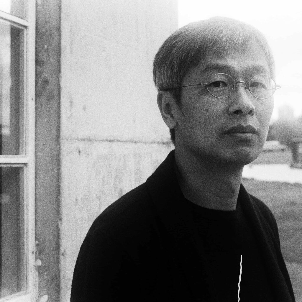 black and white headshot of speaker Liu Yichun