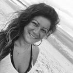 black and white headshot of Carolina San Miguel on a beach