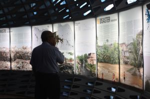 A visitor browses the City Form Lab’s exhibition on Indonesia’s growth