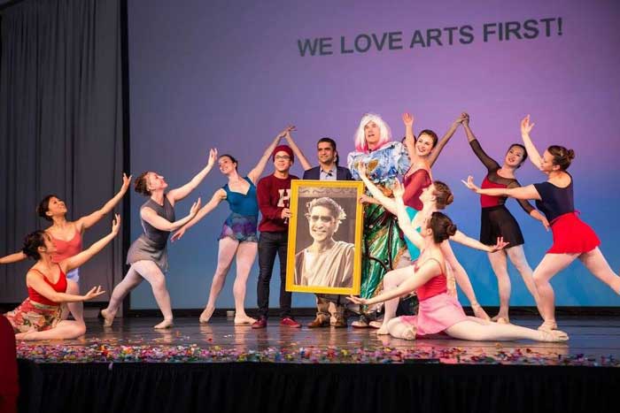 A student dance performance on stage.