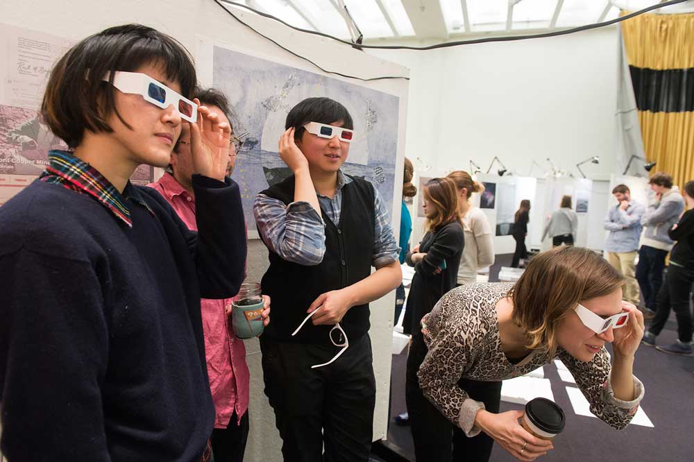Students try out 3D glasses at a gallery.
