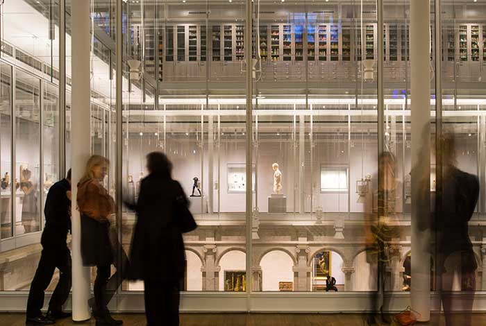 Visitors walk through the halls of the Harvard Art Museum.