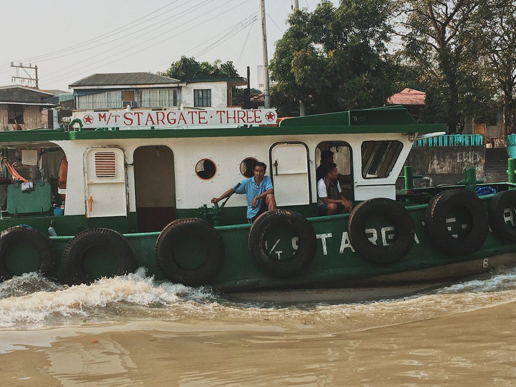 Despite the heavy pollution of the Pasig River, fishermen try to make a living off of the river.