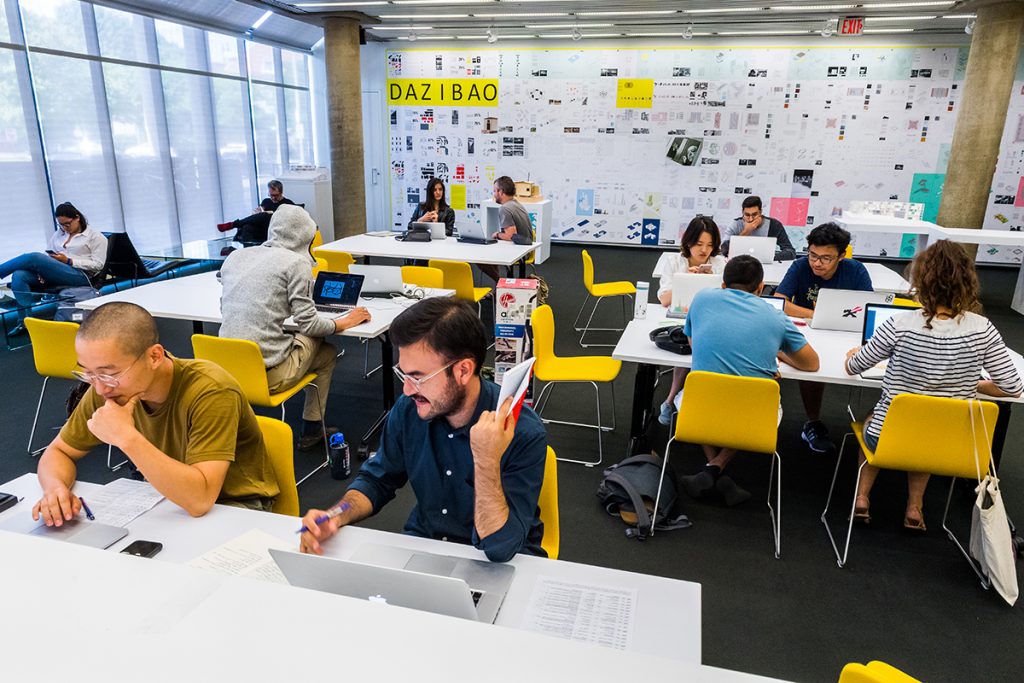 Students work at tables in Loeb Library.