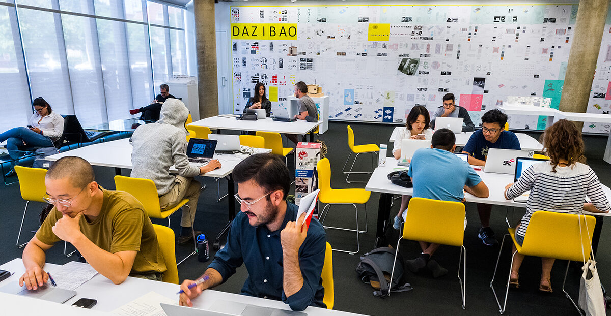 Students work at tables in Loeb Library.