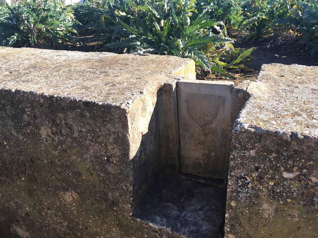 Stone plates which farmers lift up during plot irrigation.