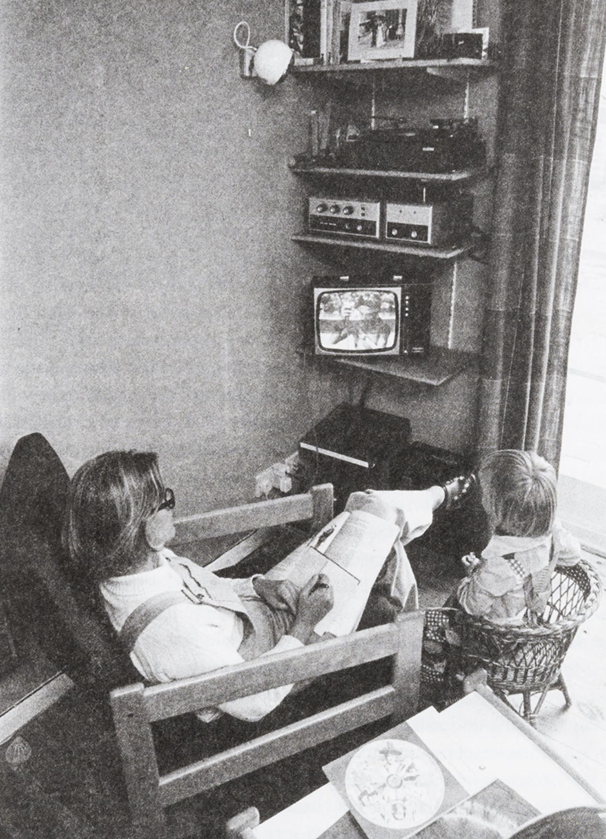Image of a woman watching Open University course about about Architecture on her tv set.