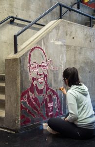 Liang finishes a portrait of Helena in the Pit. 