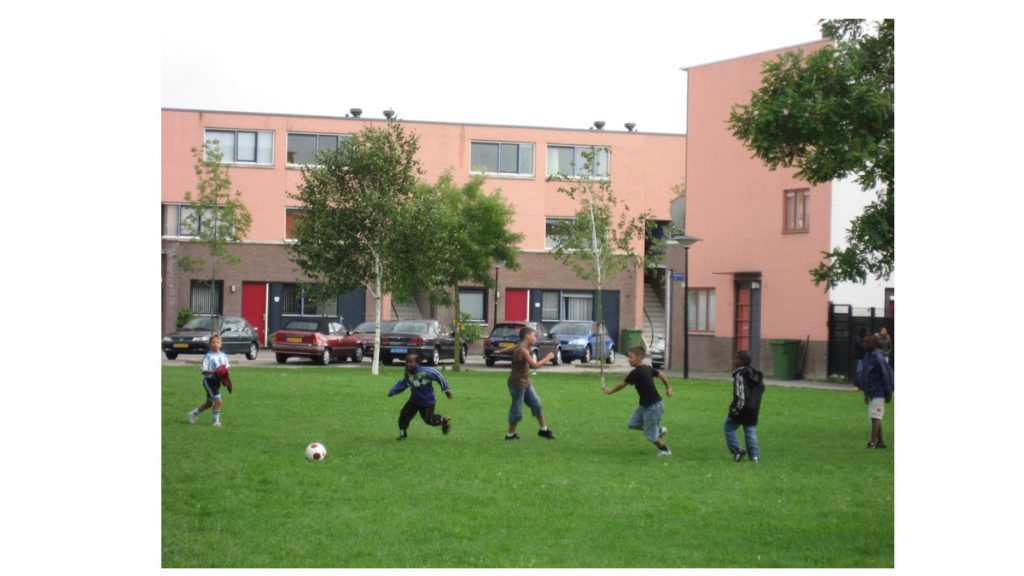 Multiracial group of young boys playing soccer in Amsterdam