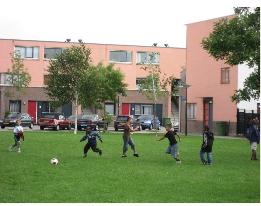 Multiracial group of young boys playing soccer in Amsterdam