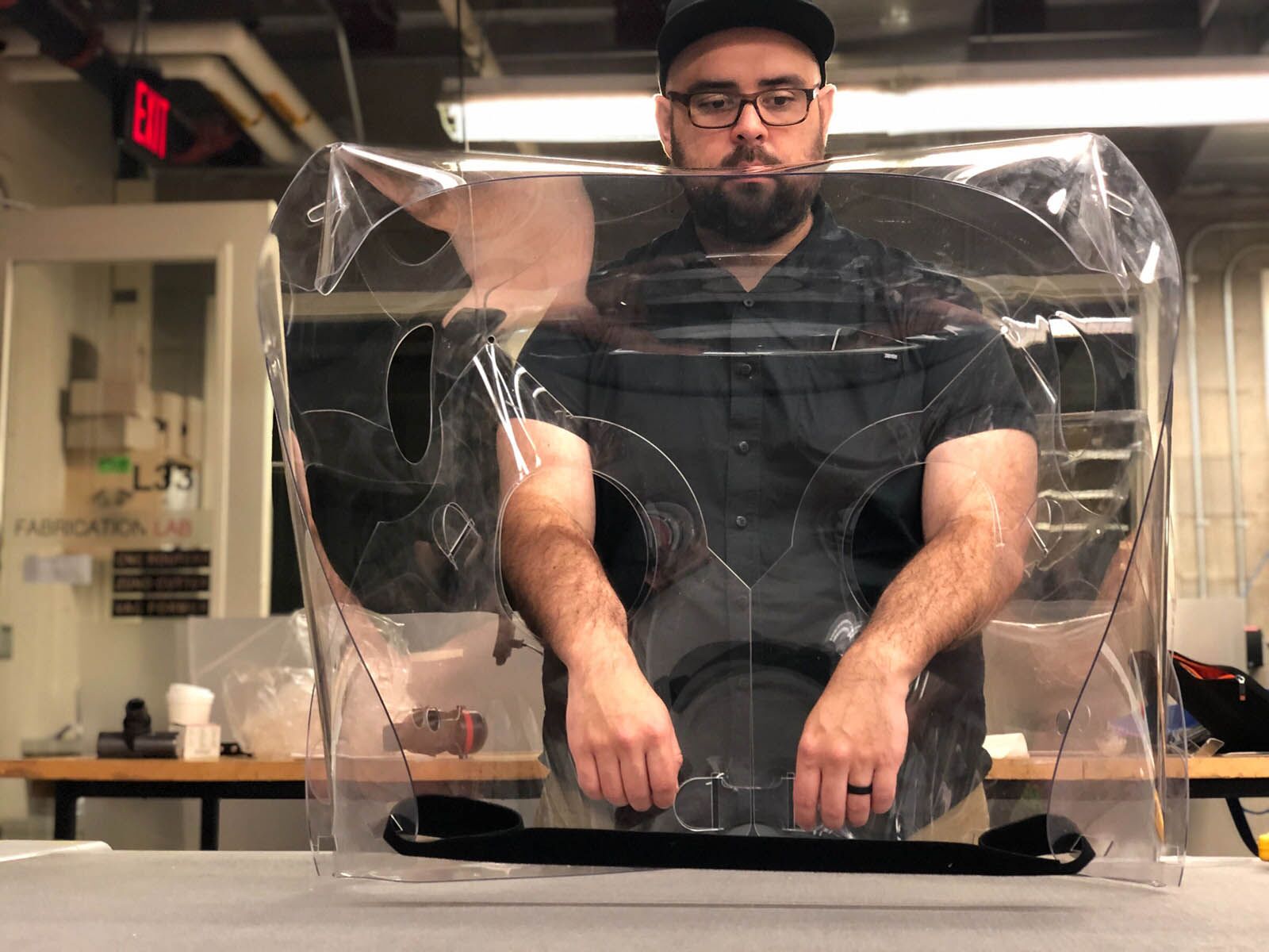 The GSD's Chris Hansen works on fabrication of a patient isolation hood (PIH) prototype