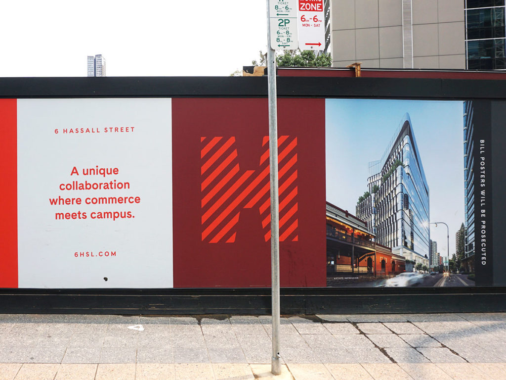 Photo of billboard showing university building