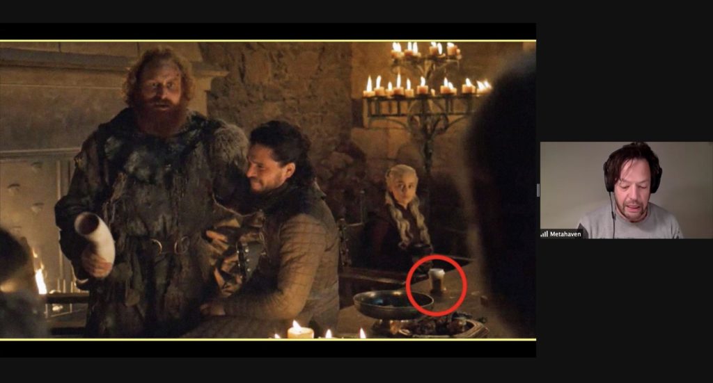 Screenshot of a presentation by Metahaven on Zoom. Metahaven is visible on the right side of the screen. The presentation shows an image from the television show Game of Thrones, in which a disposable coffee cup is sitting on the table, circled in red.