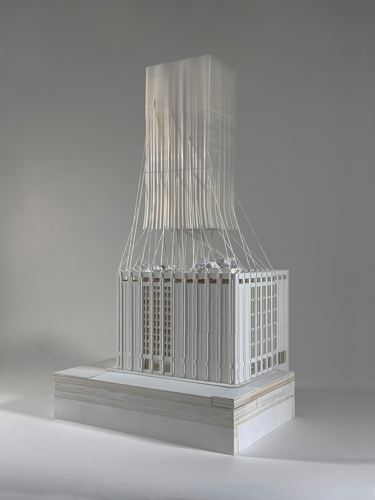 Photograph of building model in front of white background