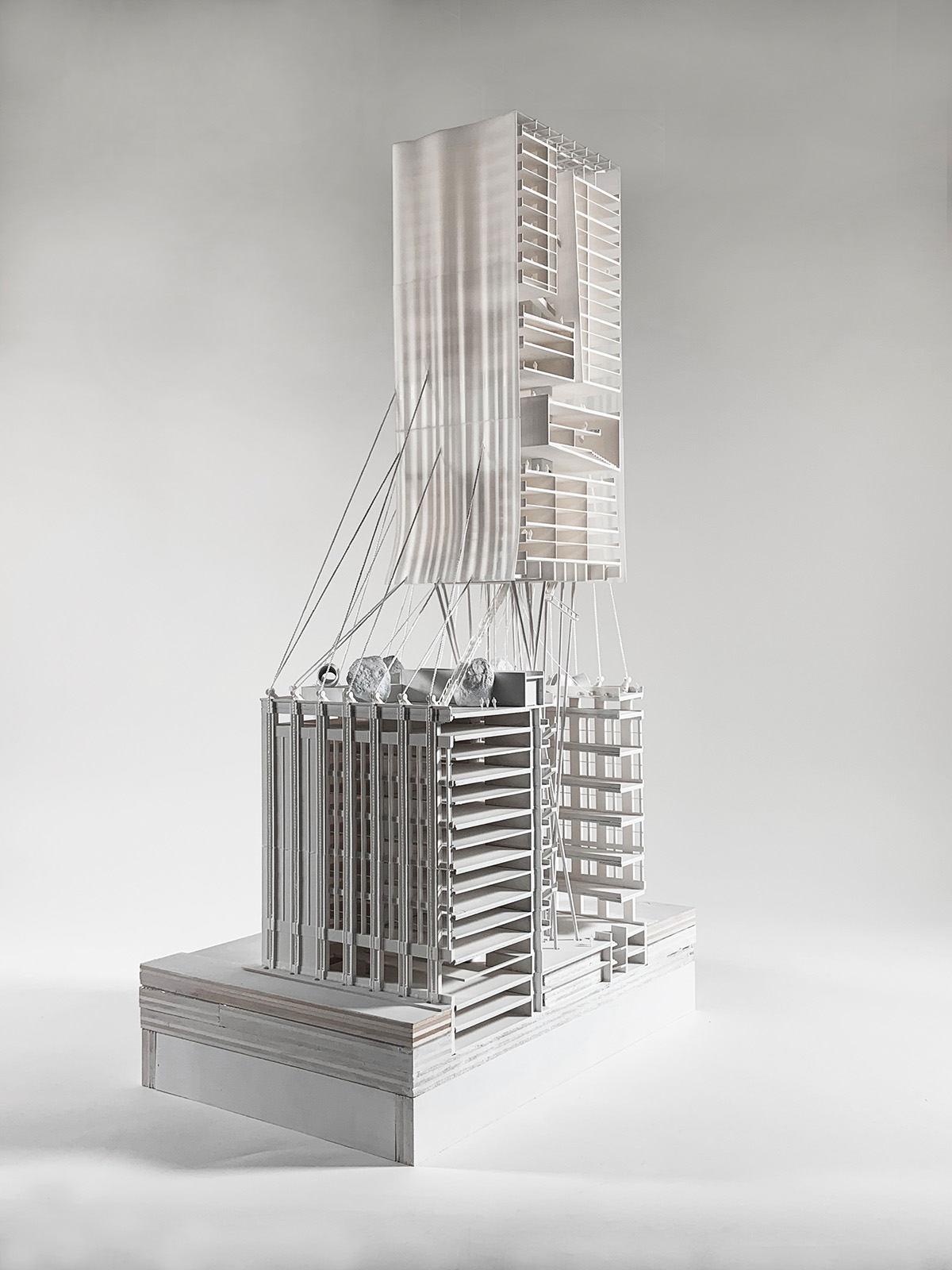 Photograph of building model in front of white background