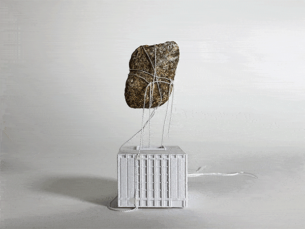 animated gif showing tethered rock floating above a building