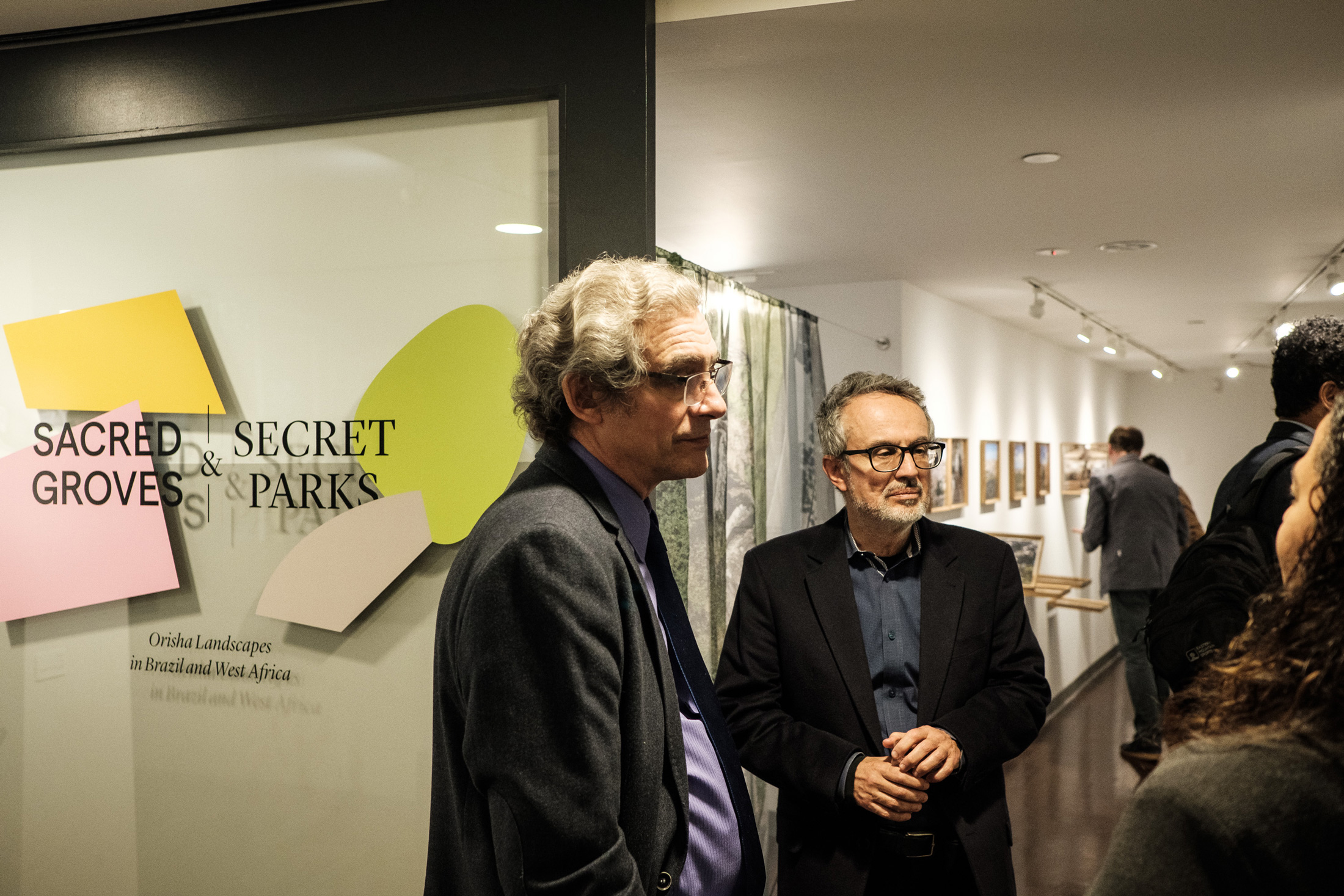 Guests and faculty in conversation at exhibition opening