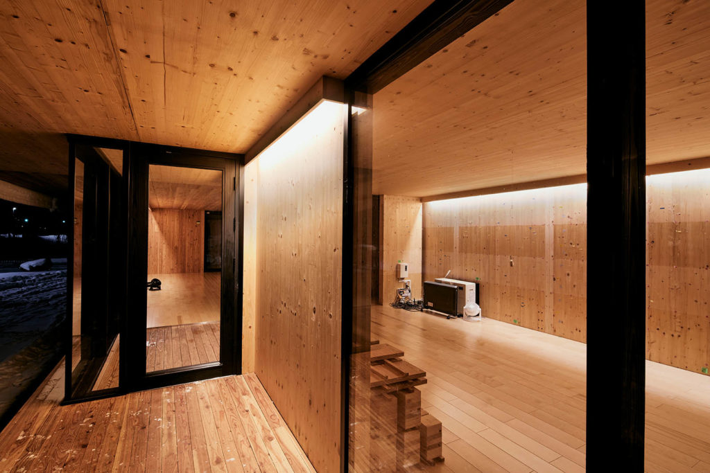 Image of warm toned CLT house at the Forest Product and Research Institutre