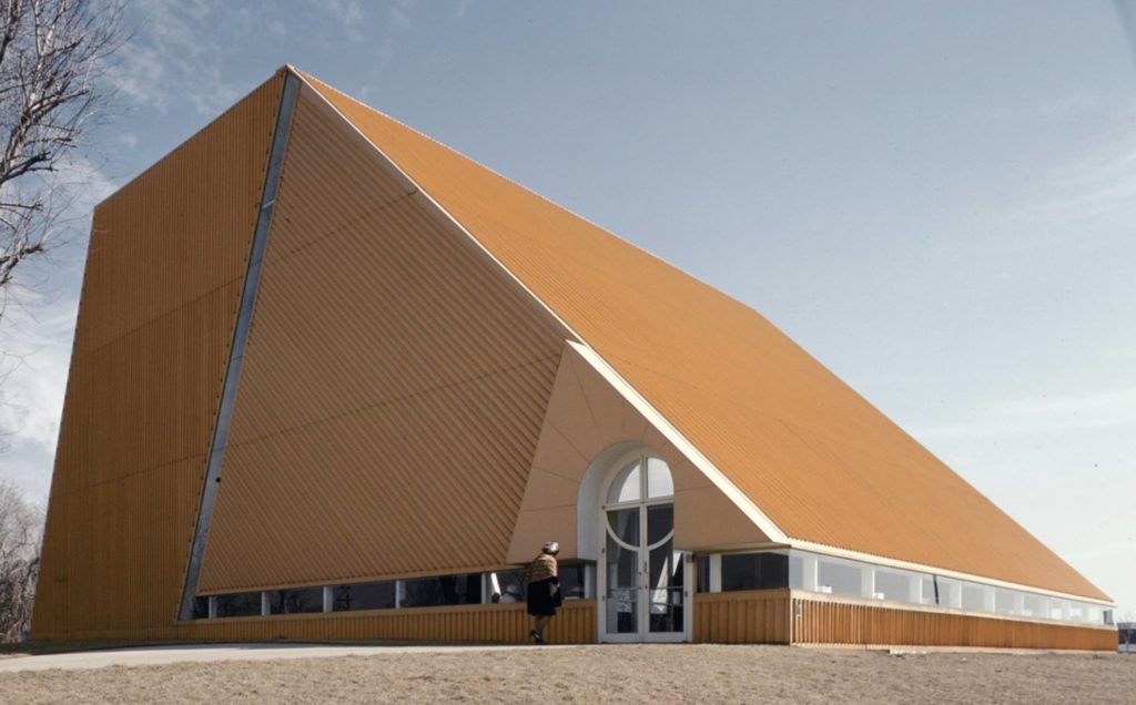 Image of bright orange church on landscape