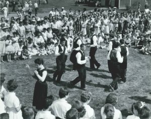 Shaker villagers performing and dancing in field