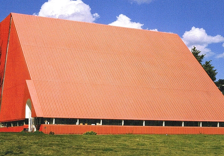 Image of bright orange church on landscape