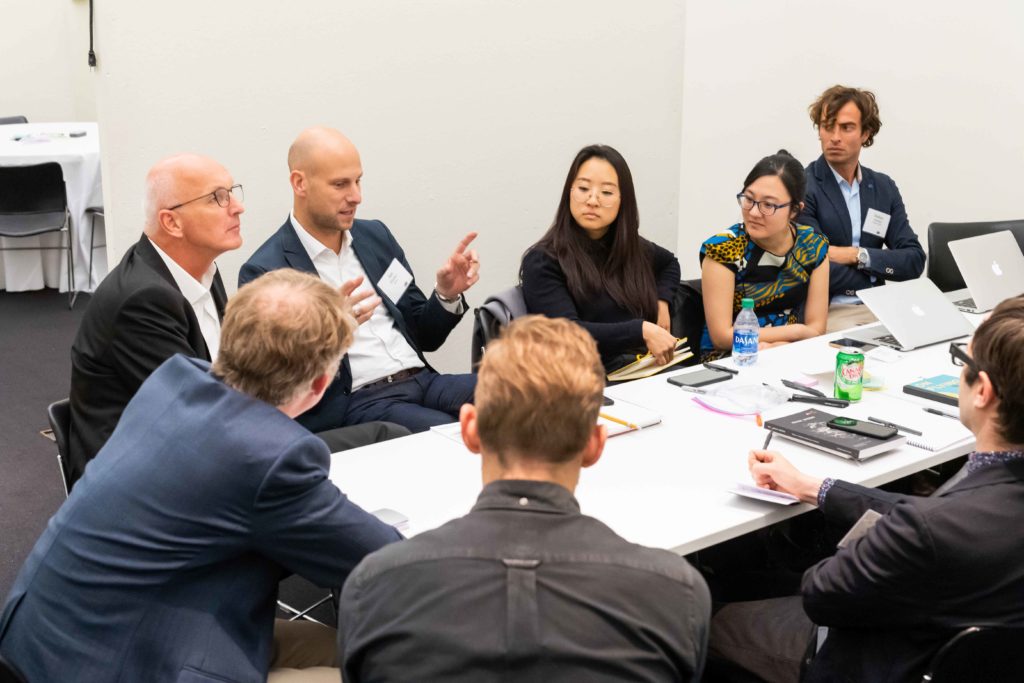 Image of round table discussion in conference room