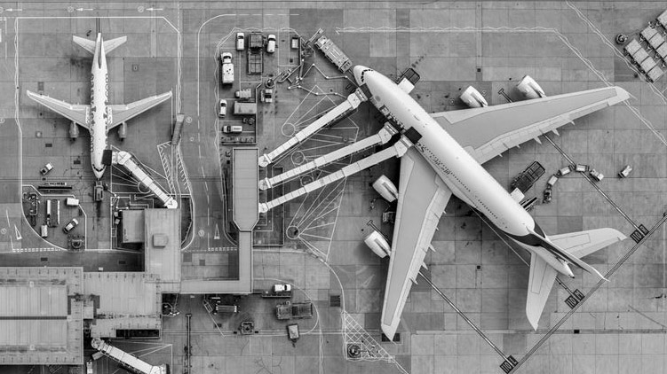 Abstract areal photograph of a plane at an airport