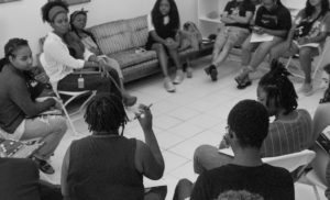 Book club members sitting in a circle. 