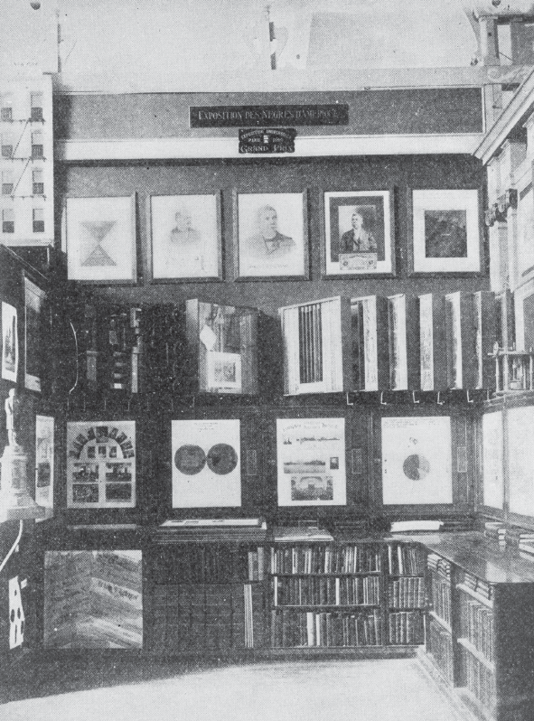 Black and white image f interior showing photographs exhibited
