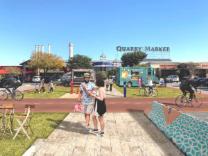 A rendering of two people standing in front of a pop-up market
