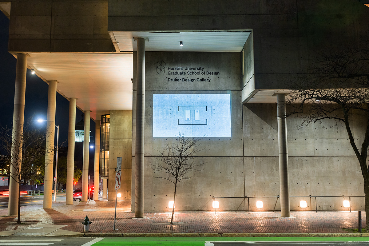 The Cambridge Street facade of Gund Hall, showing a projection of a plan of a room.