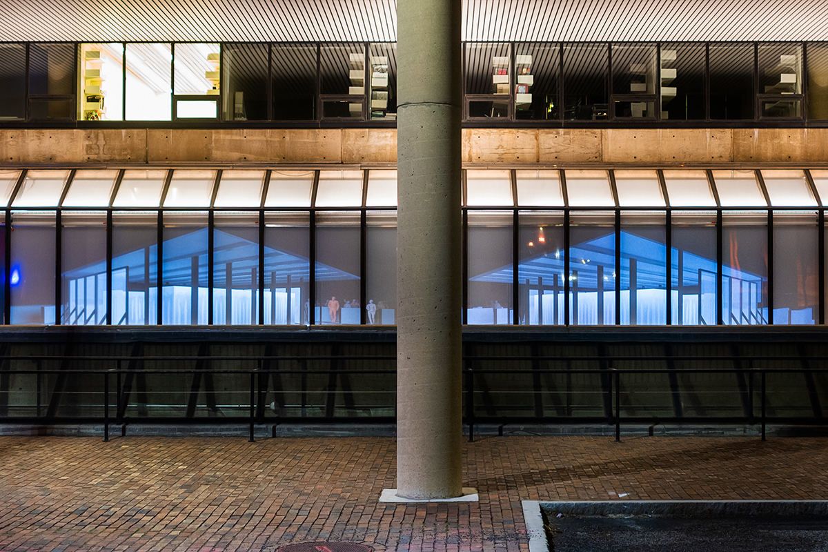 The Quincy Street facade of Gund hall, showing a projection of two buildings side by side.