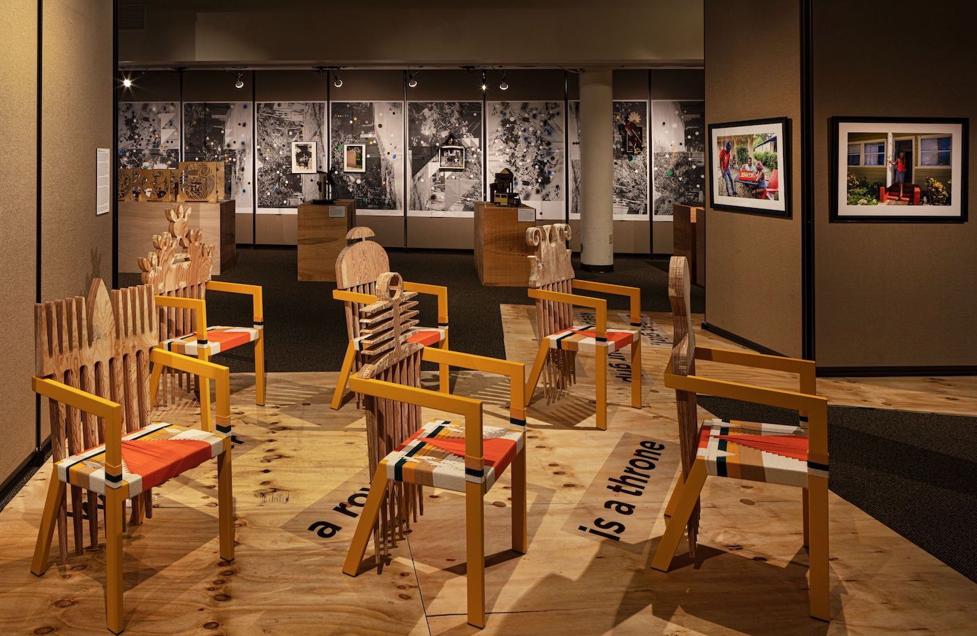 Abstract chairs set up in a gallery.