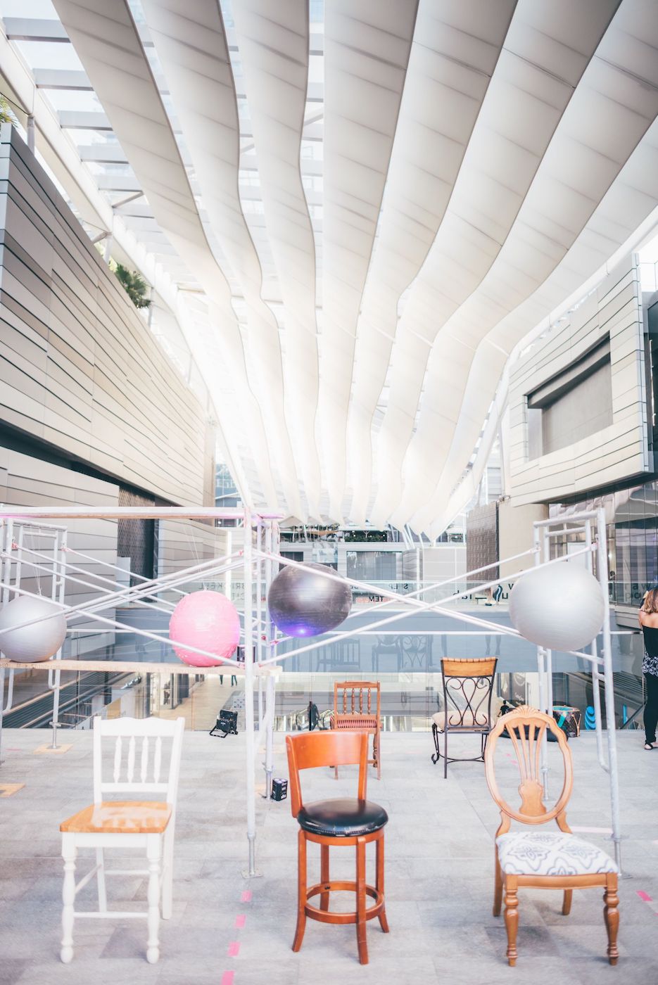 Exhibition with series of chairs.