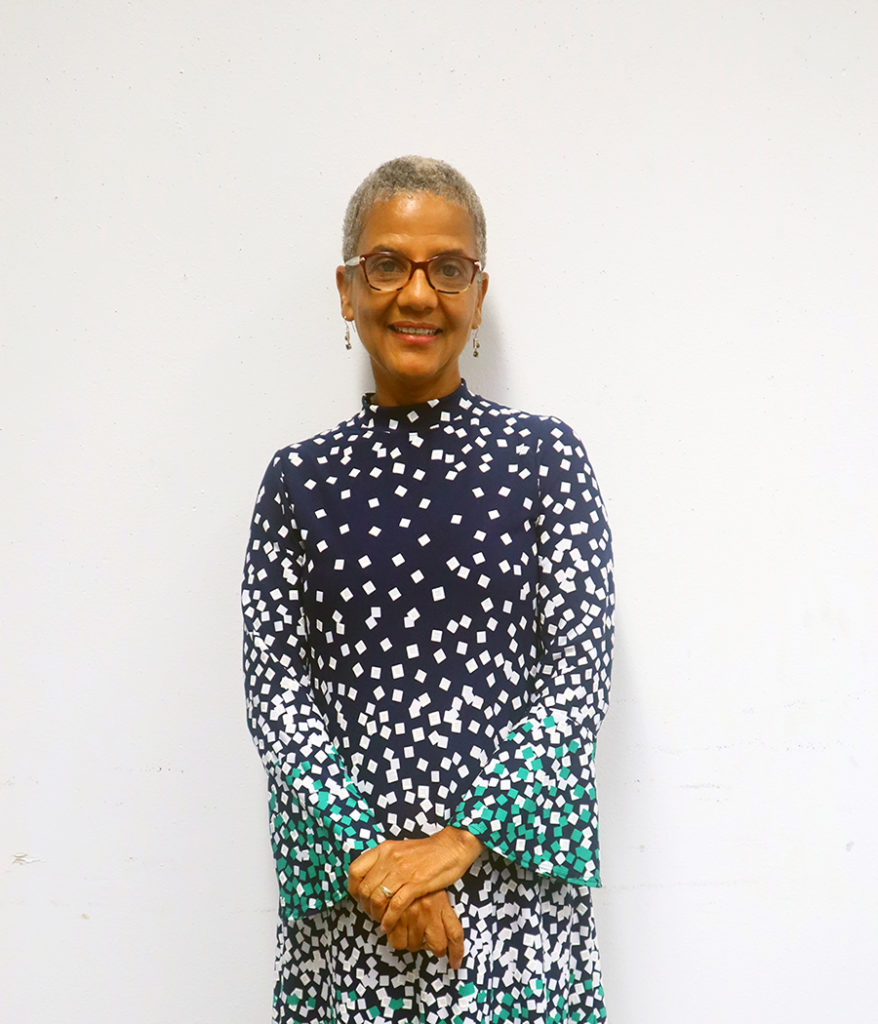 Headshot of Diane Jones Allen, who has short gray hair and wears a blue polka dot dress with long sleeves.