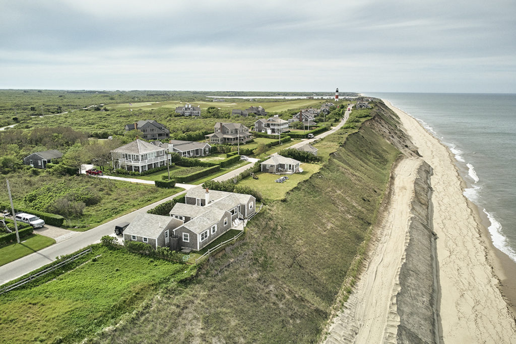 Houses on a cliff with erosion