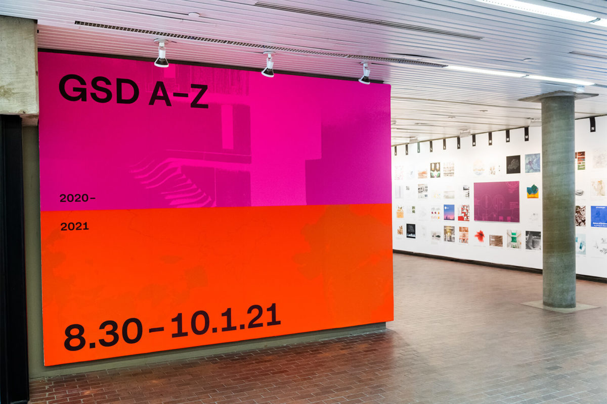 The start of the A-Z exhibition. The opening wall shows the exhibition title on a pink and red background.