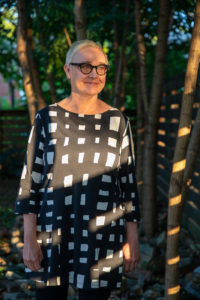 photograph of landscape architect standing in forest