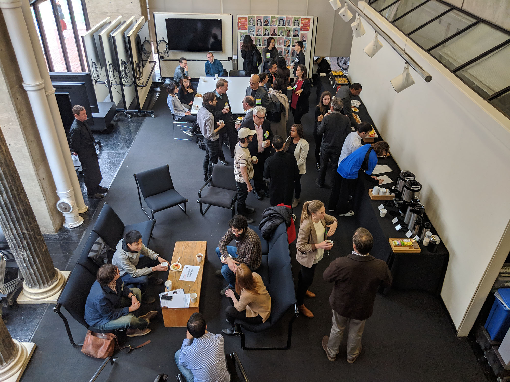 Students and alumni gather in the Pit for breakfast and conversation
