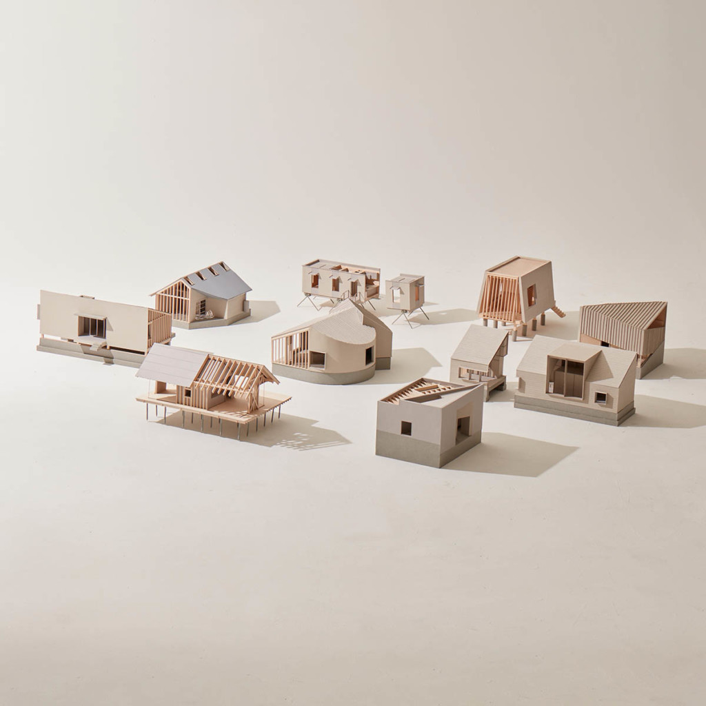 Nine models of small buildings or structures.