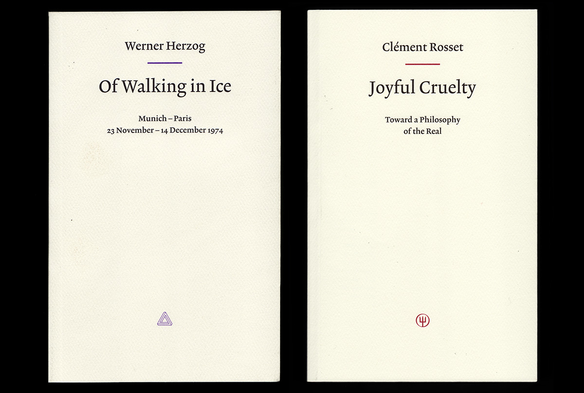 Flat-lay of two white book covers, title "Walking on Ice" and "Joyful Cruelty." Set on black background.
