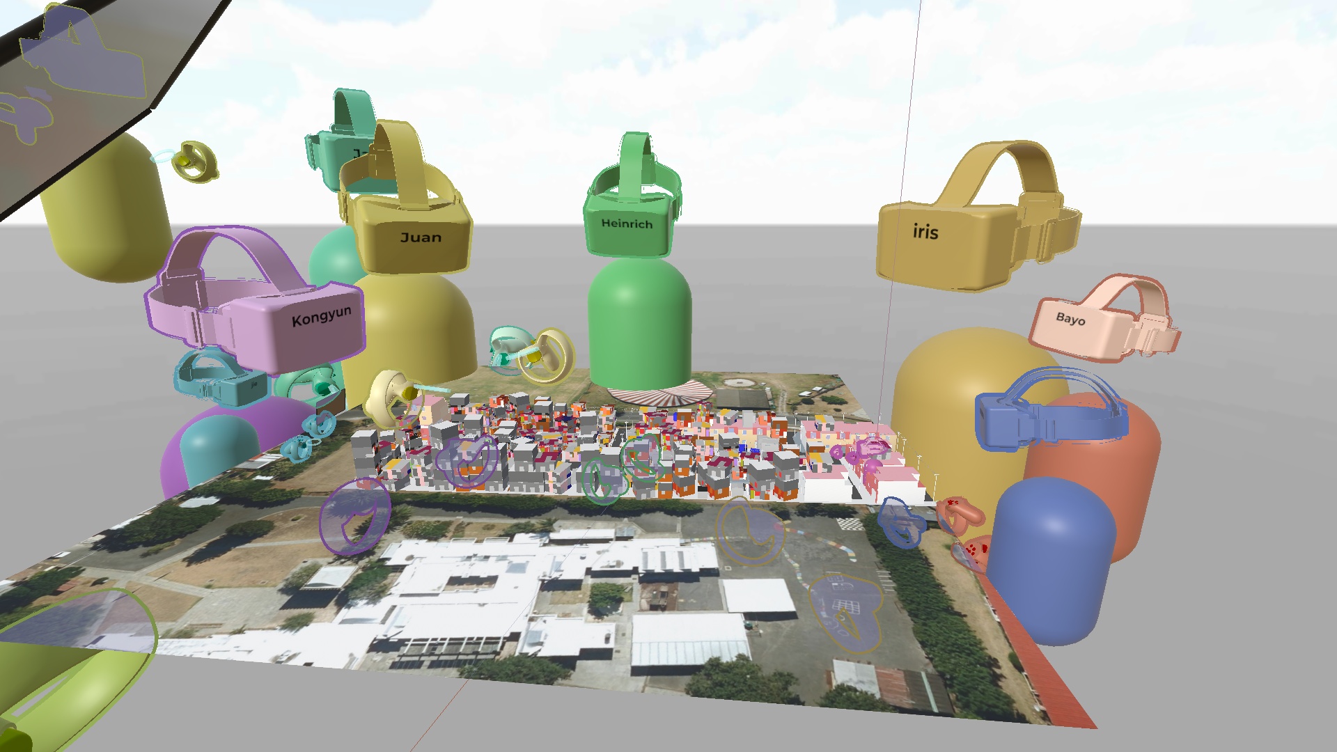 Colorful avatars float around a site model using virtual reality.