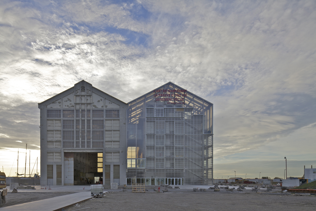 Exterior streetview of shed-like highrise building