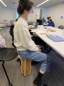 Student sits on the tippy school, a design that challenges ideas about disability.