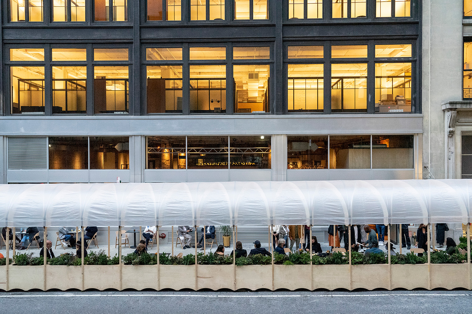 Re-ply structure spanning across city storefronts.