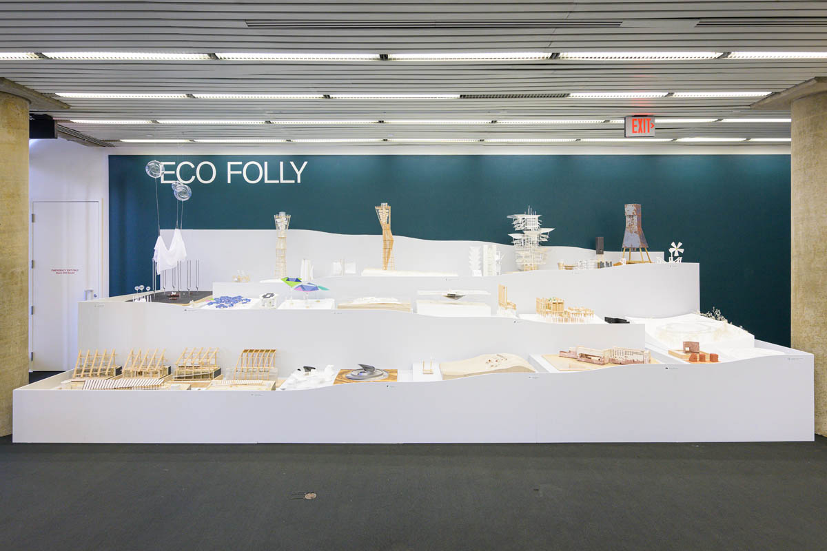 A large stepped display of student models. The display is three flights of steps deep and fits between two cement columns.