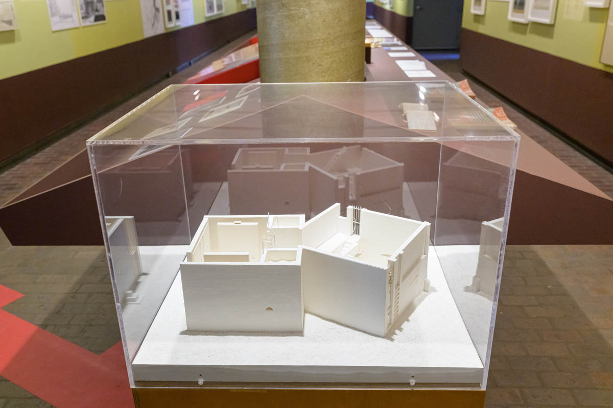 A white model in a vitrine.