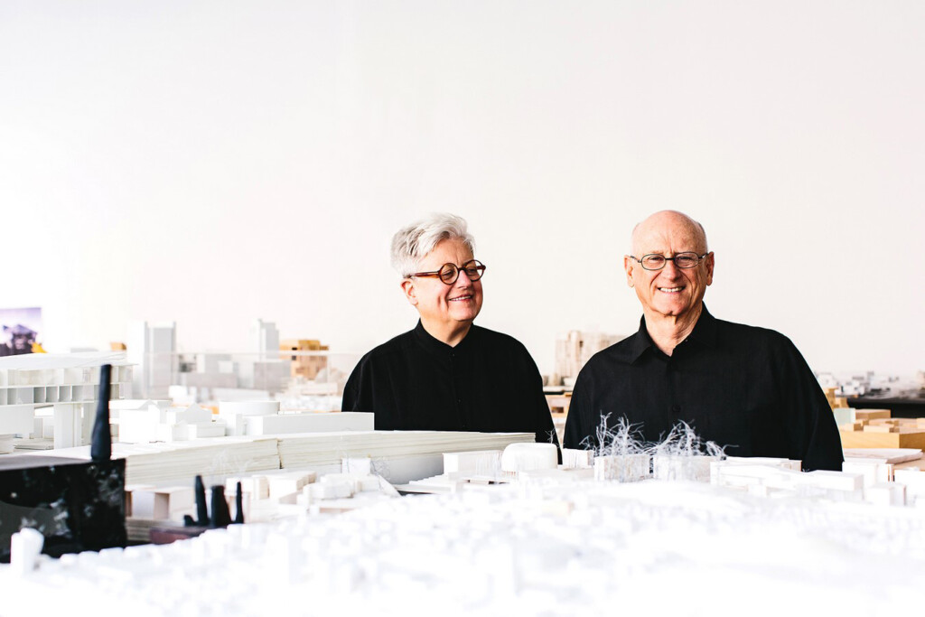 Photo of Merrill Elam and Mack Scogin with an architectural models around them