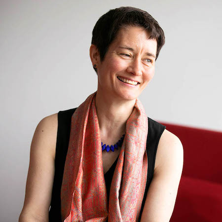 Headshot of Sarah Whiting looking to the right and smiling.